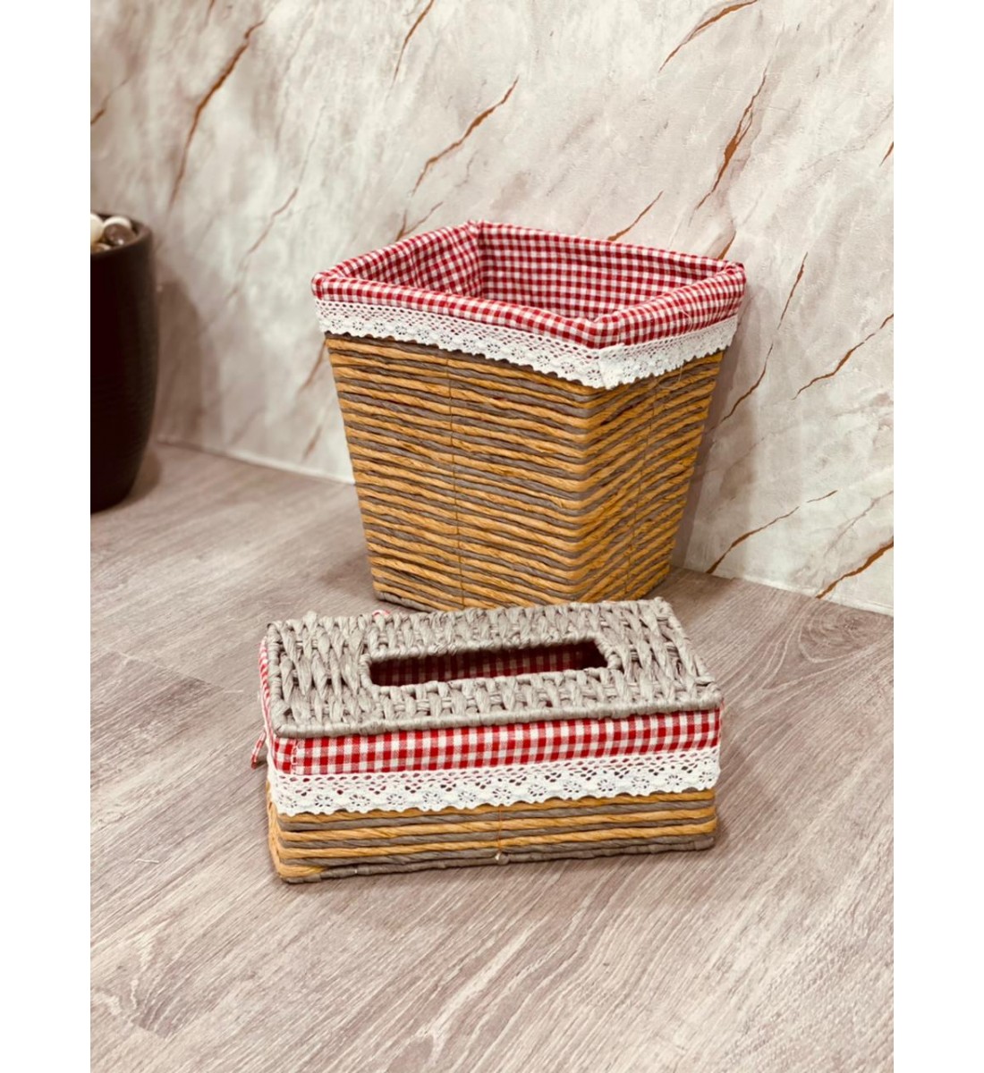 A wastebasket and a stylish and modern tissue box