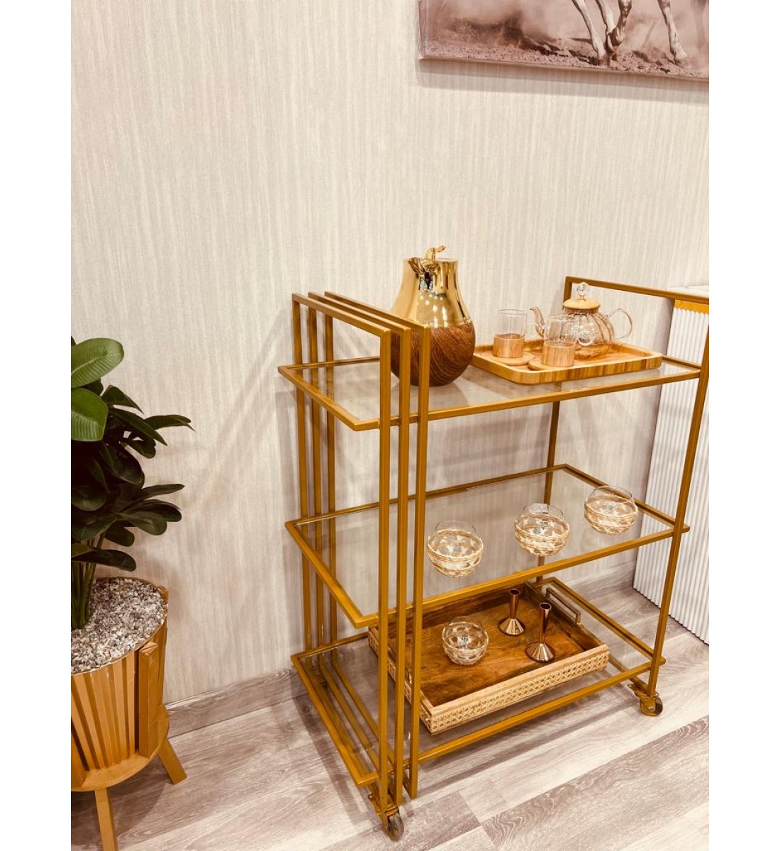 A glass serving cart with golden iron edges, 3 floors, with easy-to-move wheels (77 * 41 * 95) cm
