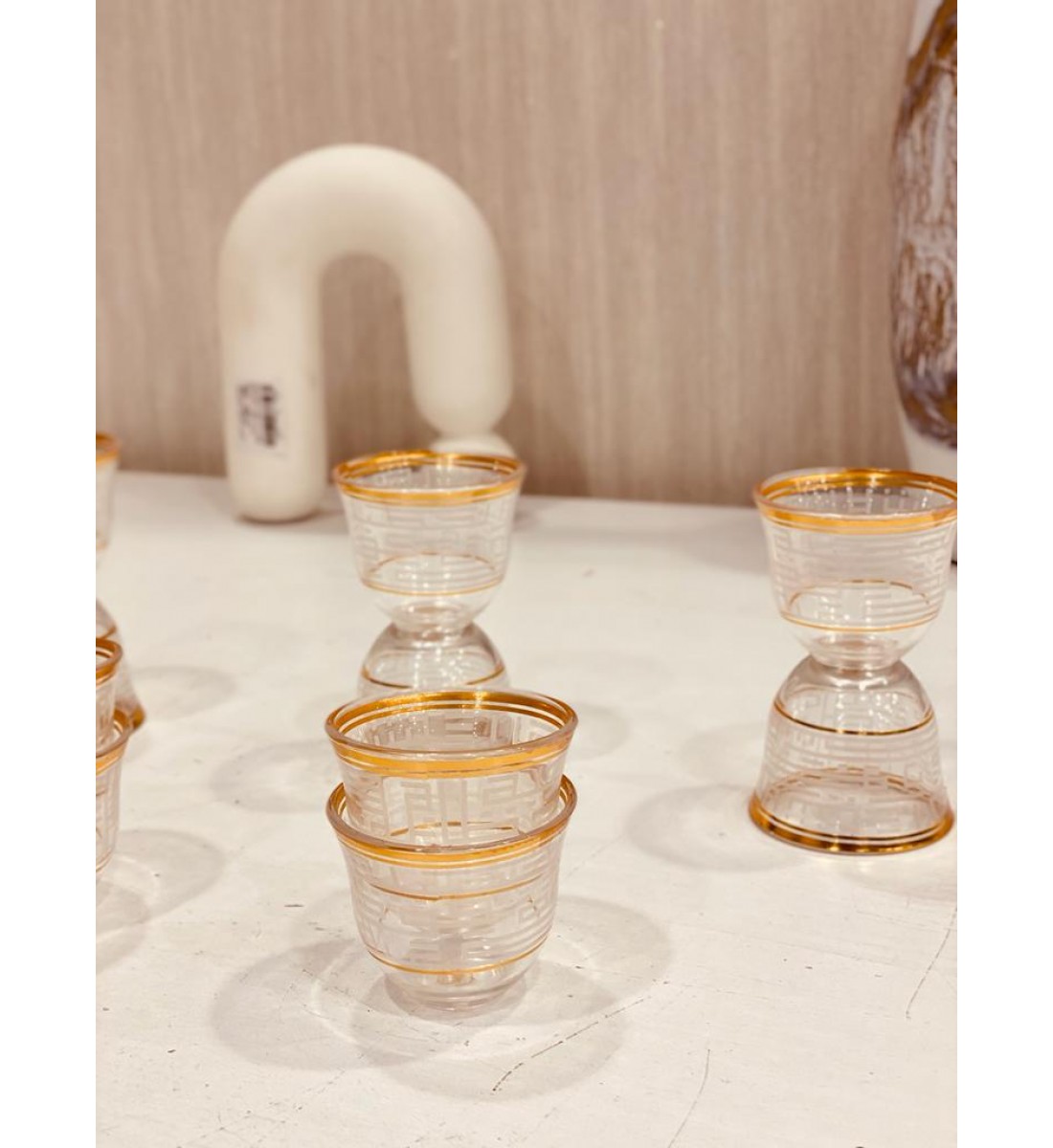 A set of white glass cups with a gilded pattern, 12 pieces