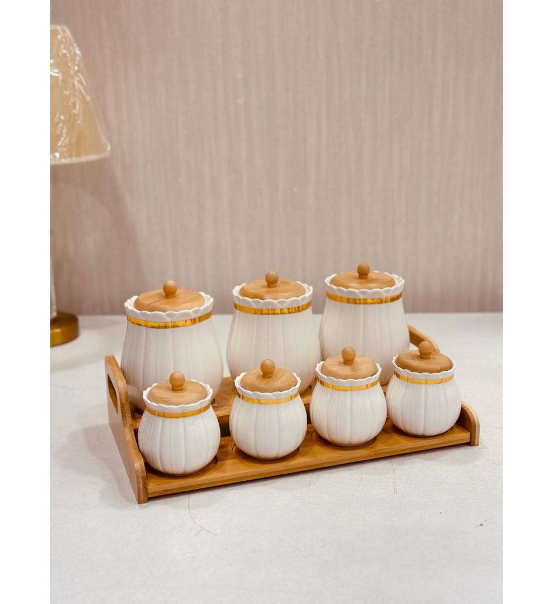 Gilded ceramic spice jars set with a wooden stand, 8 pieces
