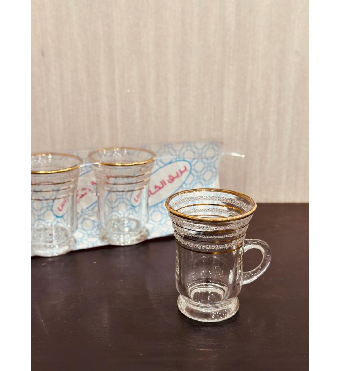 A set of glass tea bowls with a gilded line, of heavy material (6) pieces
