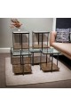 A set of glass tables with a wooden base, 5 pieces