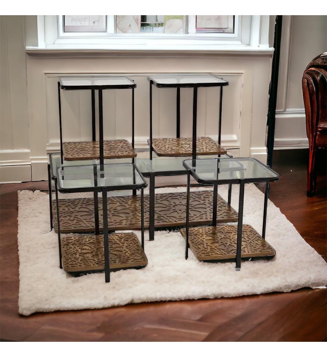 A set of glass tables with a wooden base, 5 pieces