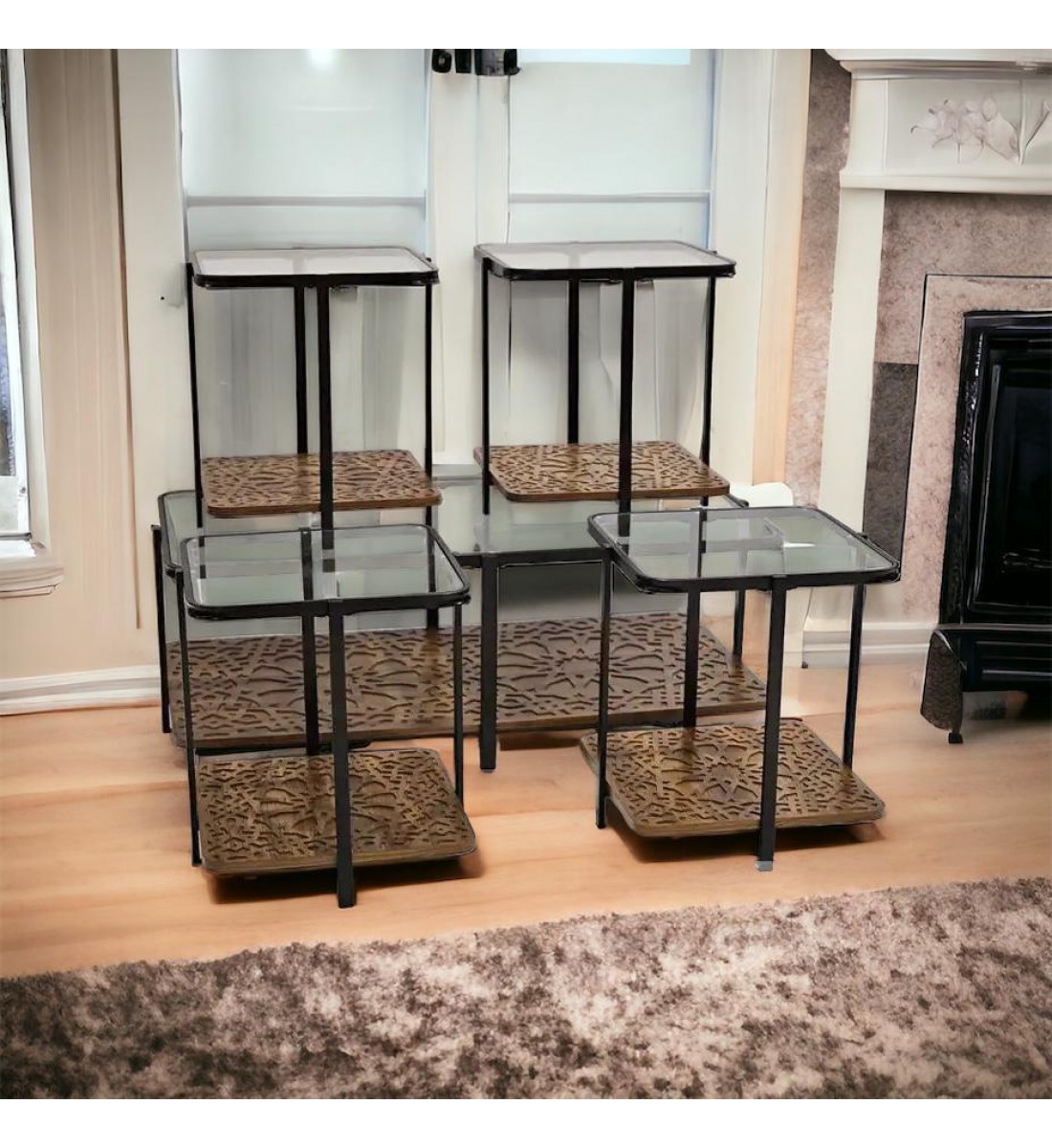 A set of glass tables with a wooden base, 5 pieces