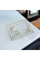 Golden tablecloths with the phrase “Hanaa and Wellness”.