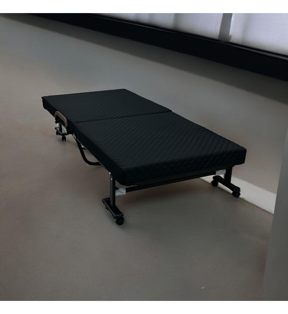 Bed with foldable mattress and movable wheels, black