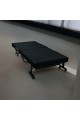 Bed with foldable mattress and movable wheels, black