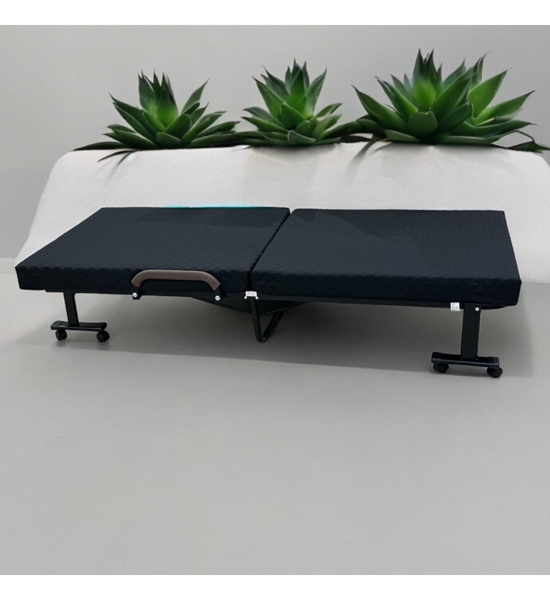 Bed with foldable mattress and movable wheels, black