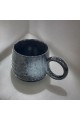 Ceramic mug with black colored handle