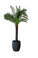 A tree decorated with palm leaves, a black stand, approximately 3 cm high