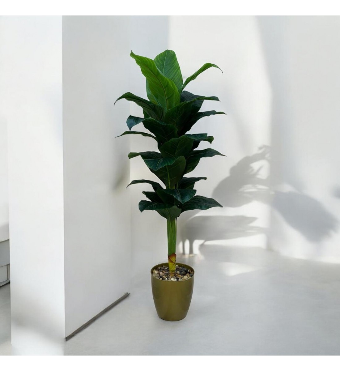 A tree decorated with a golden banana, approximately 140 cm