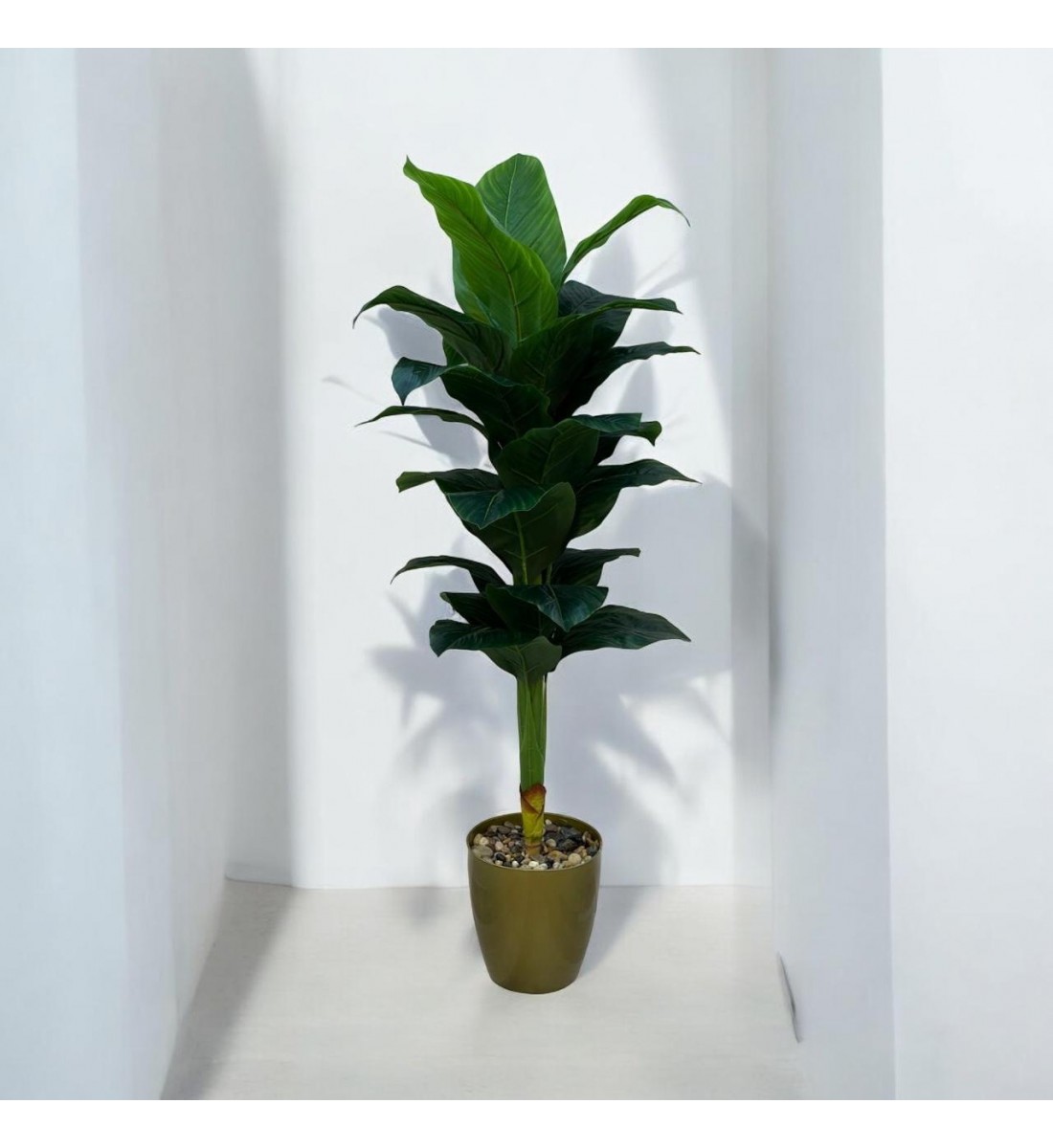 A tree decorated with a golden banana, approximately 140 cm