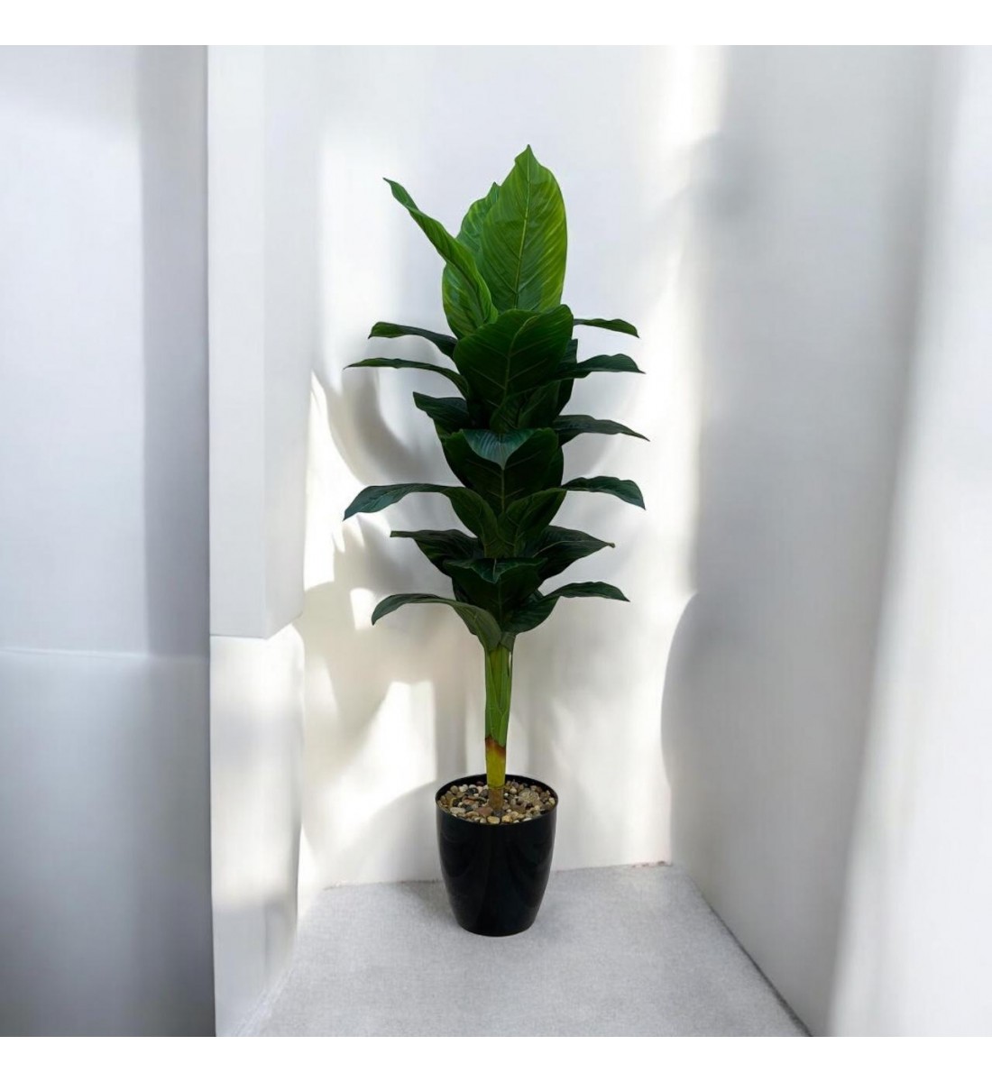 A tree decorated with black parked bananas, approximately 140 cm