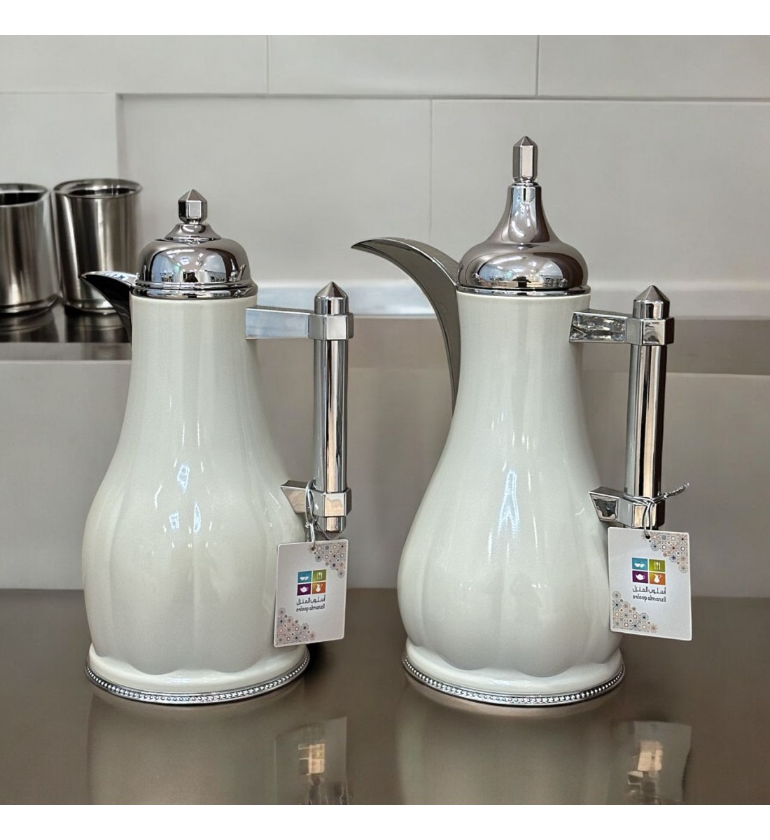 White silver tea and coffee thermos set with silver handle