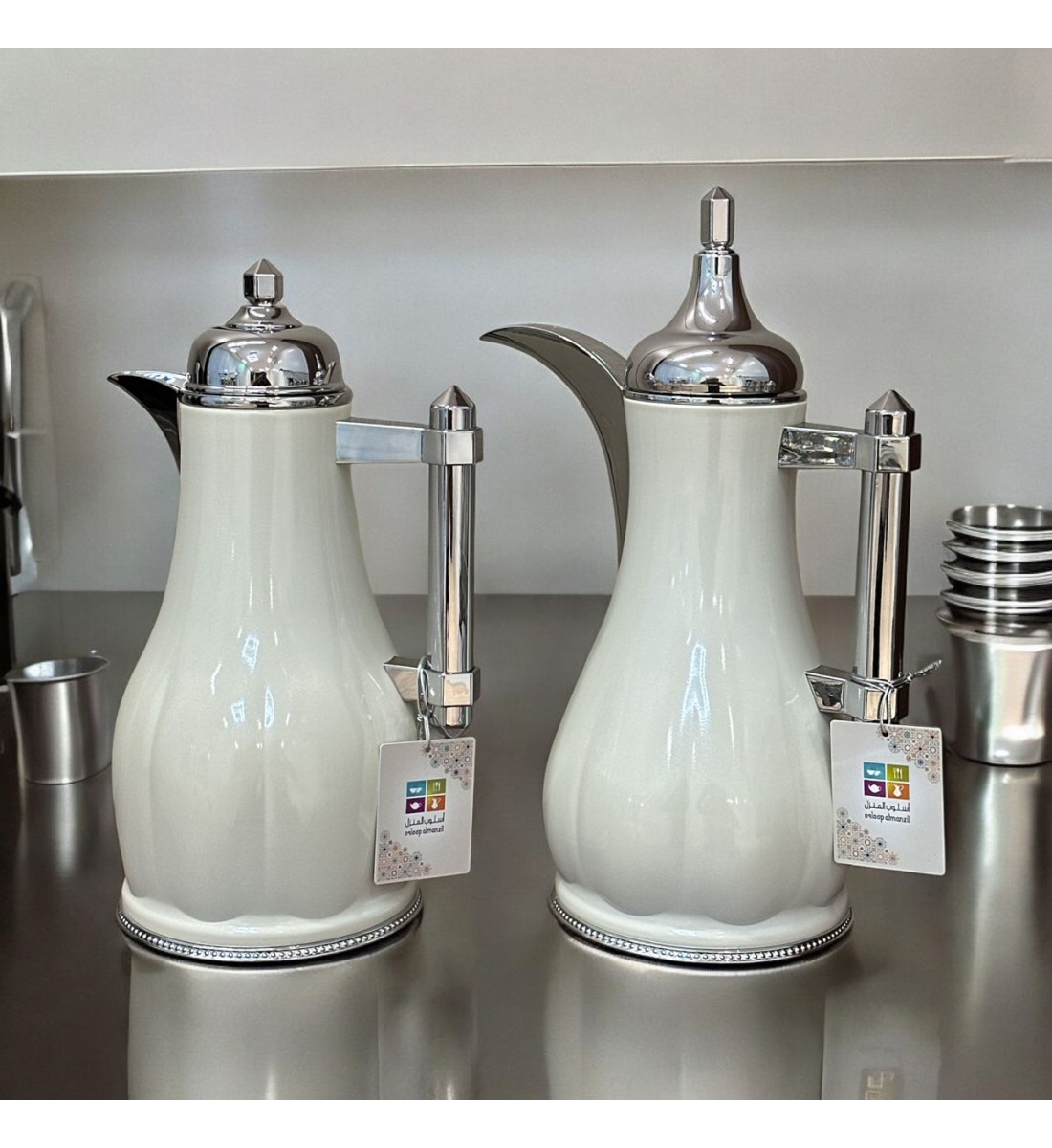 White silver tea and coffee thermos set with silver handle