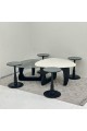 6-piece table set, the first table top is a marble alternative with a smooth texture, and the second table top is glass with black wooden bases.