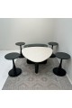 6-piece table set, the first table top is a marble alternative with a smooth texture, and the second table top is glass with black wooden bases.