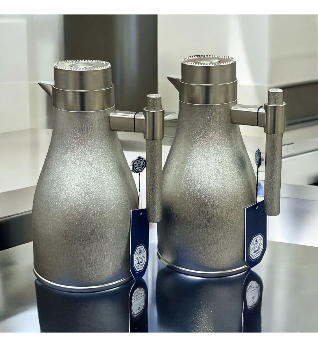 طقم ترمس اجوان فضي بلاستيك مطفي 2قطع طقم ترمس اجوان فضي بلاستيك مطفي 2قطع