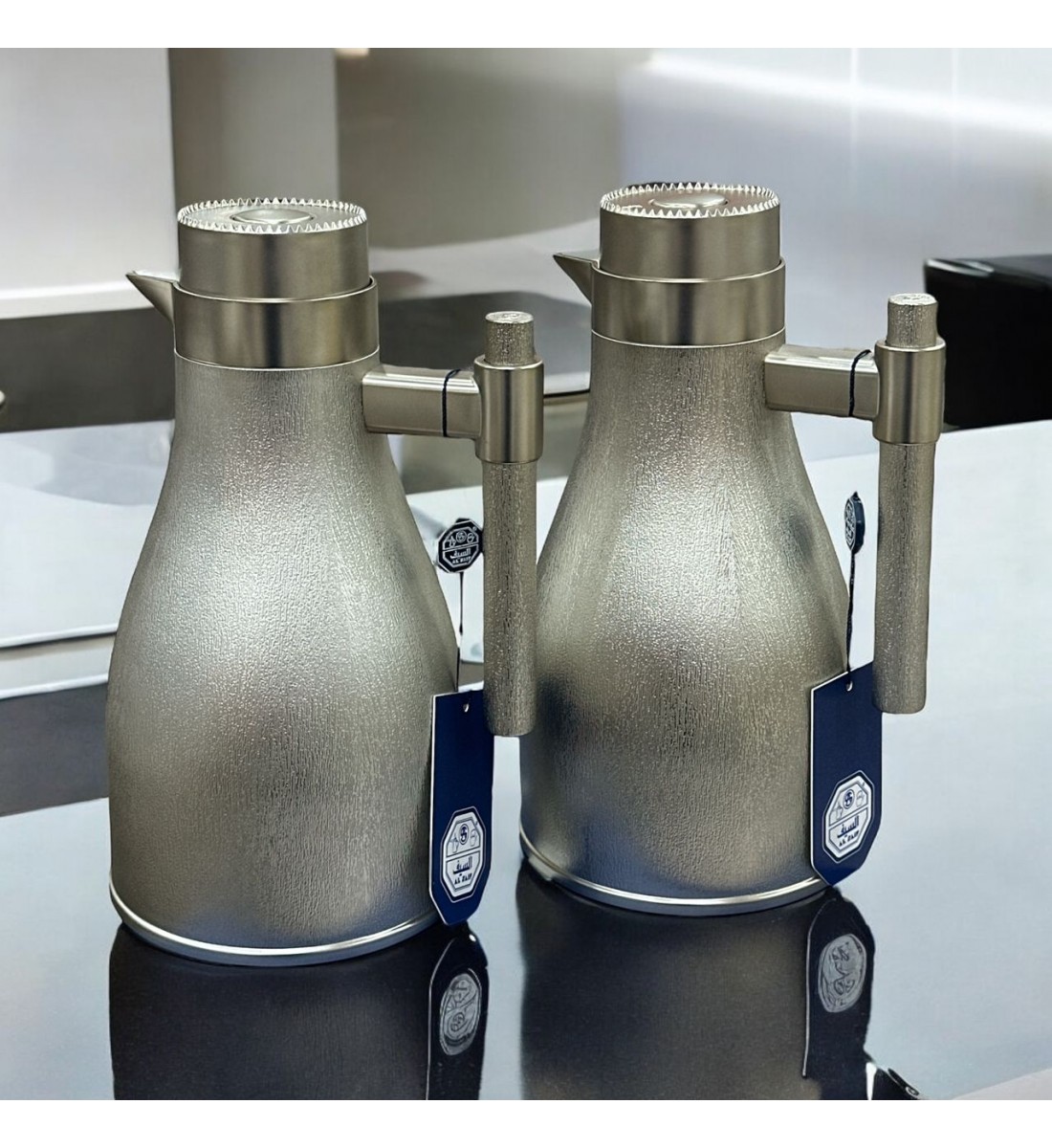 طقم ترمس اجوان فضي بلاستيك مطفي 2قطع طقم ترمس اجوان فضي بلاستيك مطفي 2قطع