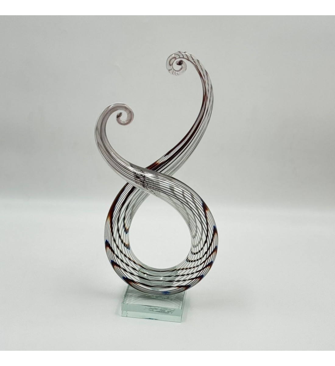  قطعة ديكور فنية مصنوعة من الزجاج الشفاف بتصميم انسيابي مستوحى من رمز النغمة الموسيقية،33×13×8سم