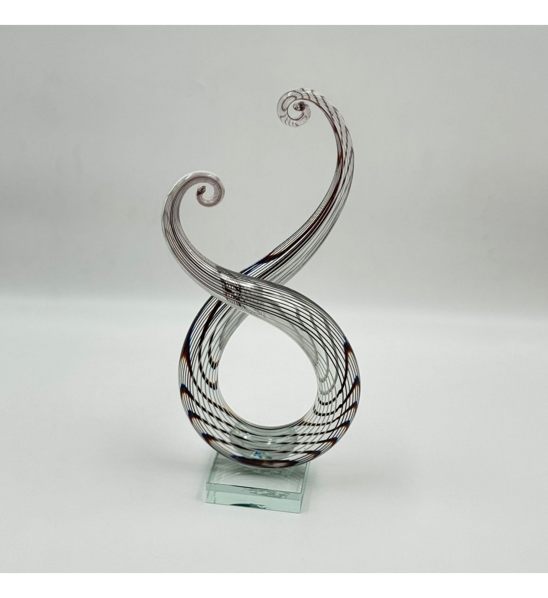  قطعة ديكور فنية مصنوعة من الزجاج الشفاف بتصميم انسيابي مستوحى من رمز النغمة الموسيقية،33×13×8سم