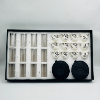 36-piece glass hospitality cup set featuring geometric details and circular bases. 36-piece glass hospitality cup set featuring geometric details and circular bases.