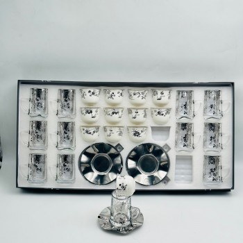36-piece tea and coffee hospitality set featuring a glass design and elegant calligraphic patterns.