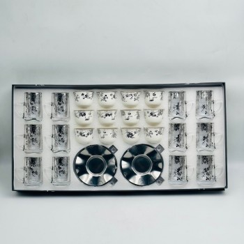 36-piece tea and coffee hospitality set featuring a glass design and elegant calligraphic patterns. 36-piece tea and coffee hospitality set featuring a glass design and elegant calligraphic patterns.