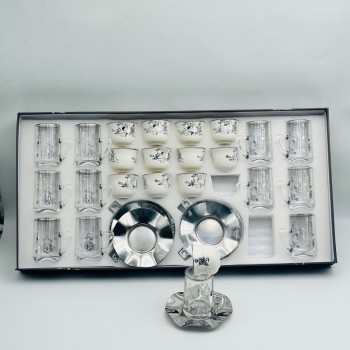 36-piece tea and coffee hospitality set featuring a glass design and elegant calligraphic patterns.
