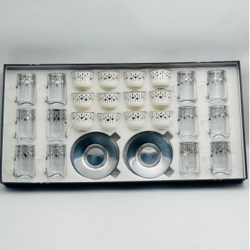 36-piece tea and coffee hospitality set featuring a glass design and elegant calligraphic patterns. 36-piece tea and coffee hospitality set featuring a glass design and elegant calligraphic patterns.