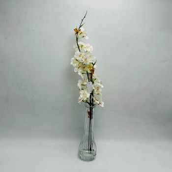 Artificial cherry blossom branches for decoration, featuring an elegant, clear glass vase.
